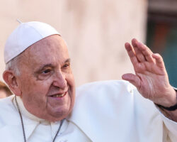 PopeFrancisWavesToTheFaithfulAsHeArrivesTo
