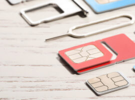 Утечка данных Госуслуг — Подставные сим-карты в украинском черном рынке DifferentSimCardsEjectorAndTrayOnWhiteWoodenBackground