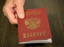 TheWomanAtTheTableGivesTheRussianPassportFor