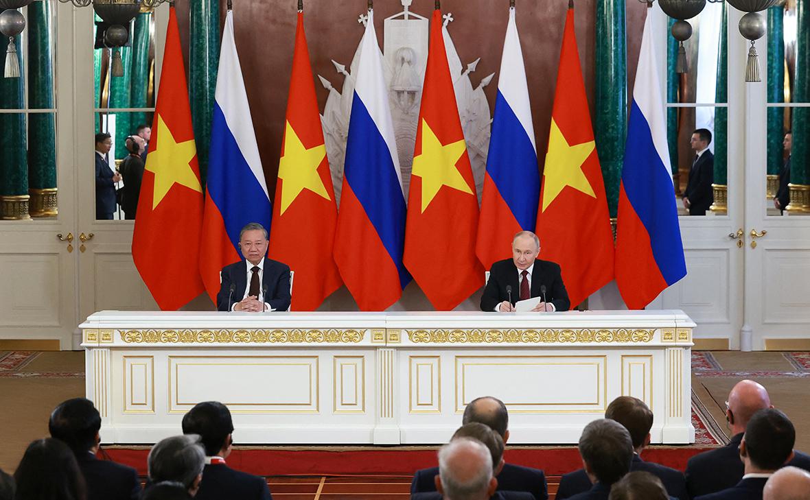 То Лам и Владимир Путин (Антон Ваганов / Reuters)