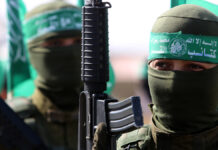 ХАМАС передал тела четырех израильских заложников через МККК PalestinianHamasMilitantsTakePartInAnAnti-israelMilitaryShow