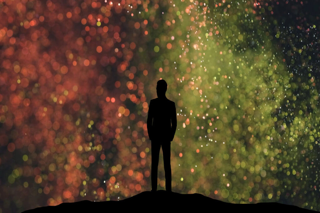 The human silhouette standing on a small shiny particles background - infovzor Силуэт человека, стоящий на фоне маленьких блестящих частиц