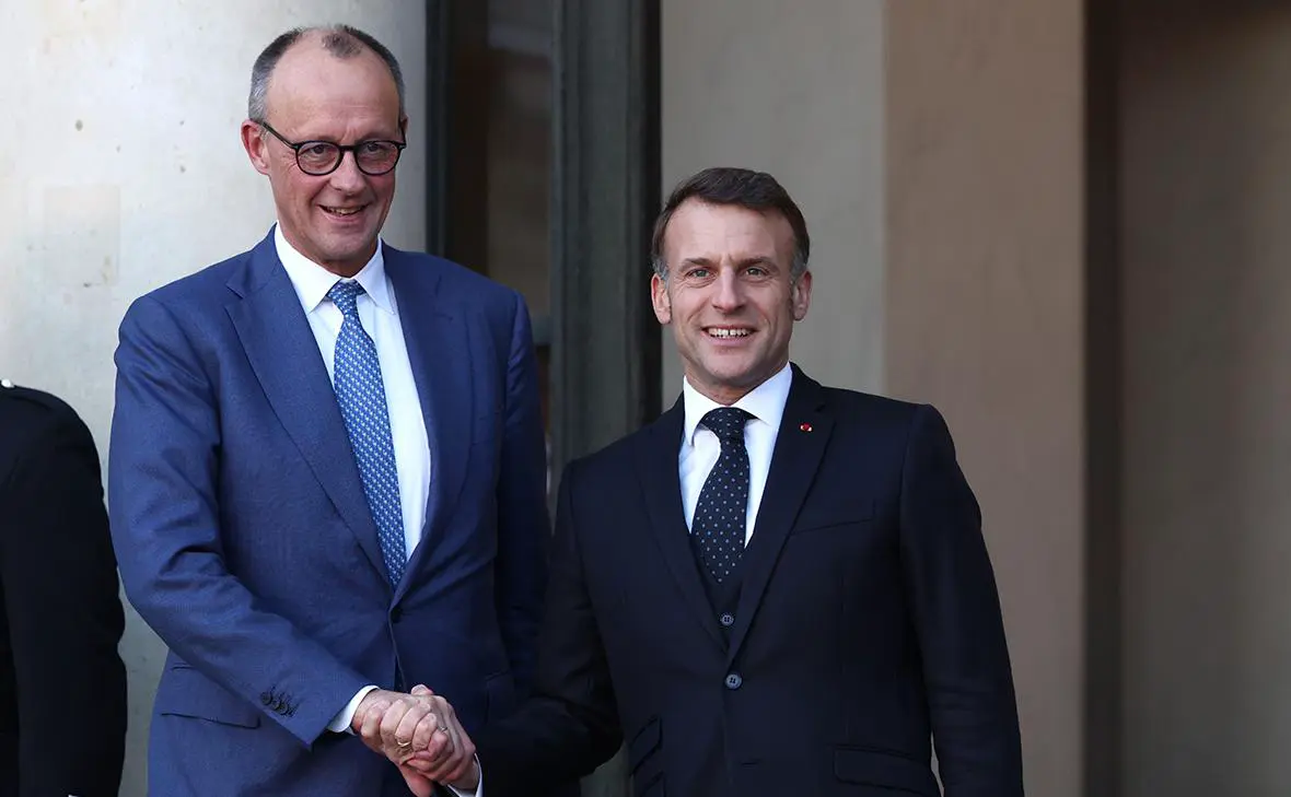 Фридрих Мерц и Эмманюэль Макрон (Tom Nicholson / Getty Images)