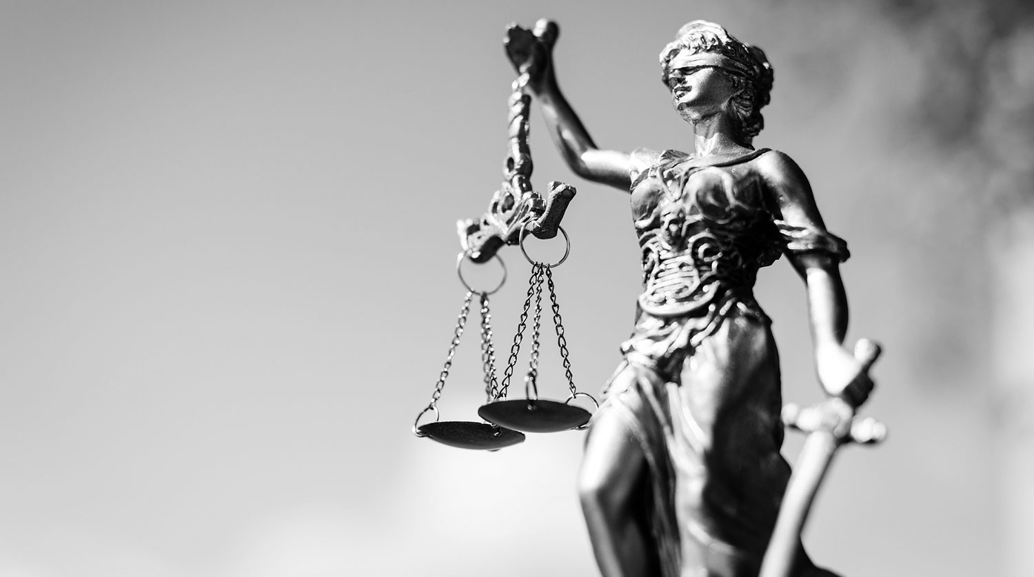 Picture of themis, femida or justice goddess on bright sky copy space background