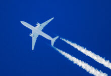 Sharp,Telephoto,Close-up,Of,Jet,Plane,Aircraft,With,Contrails,Cruising