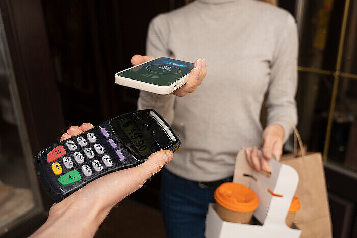 person-paying-using-nfc-technology700.jpg