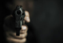 ThreatOfFirearmsMuzzleOfGunInMansHandIs