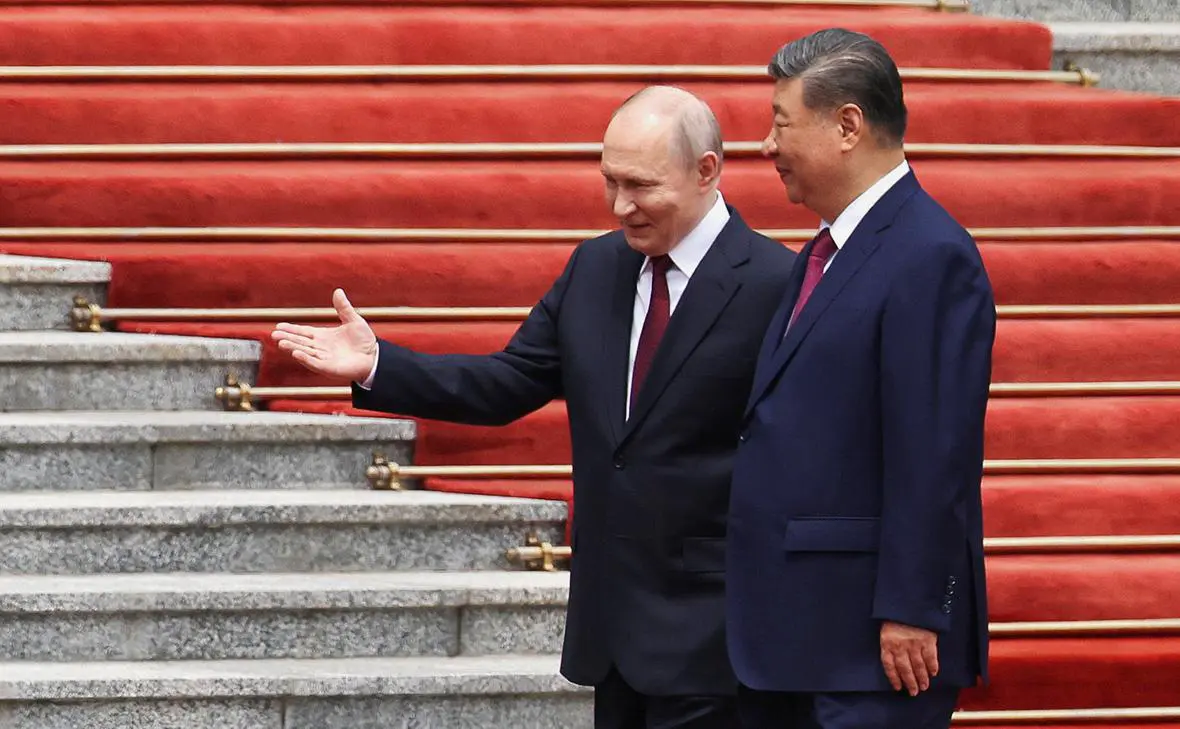 Владимир Путин и Си Цзиньпин (Максим Шеметов / Reuters)