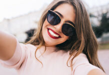 CloseupSelfie-portraitStudentOfAttractiveGirlInSunglassesWithLong