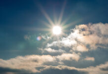 SunsetBlueSkyBrightSunShinesThroughCloudsniceSunsetEvening