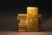 GoldBullionBarOnDarkBackgroundLargeCastInvestmentGold