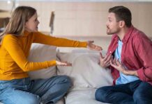 MarriedCoupleSpousesQuarrelSquabblingFightingVigorouslyGesticulatingWhileSitting