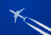SharpTelephotoClose-upOfJetPlaneAircraftWithContrailsCruising