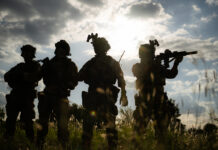 5% от сегодняшнего населения Земли выживет после третьей мировой Soldier holding gun and showing action success or war win speci