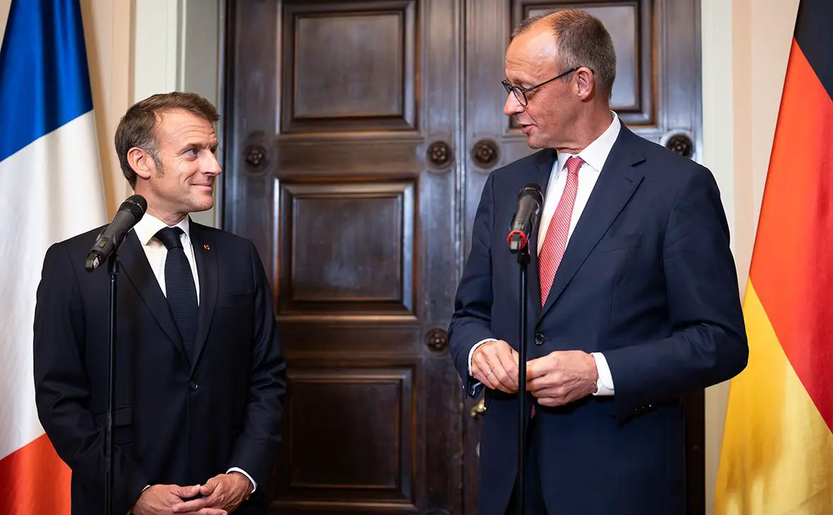 Эмманюэль Макрон и Фридрих Мерц (слева направо) (Christian Mang / Getty Images)