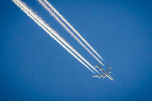 Airplane,In,Blue,Sky,With,Plane,Trails