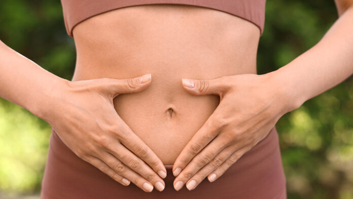 Healthy,Digestion.,Woman,Touching,Her,Belly,Outdoors,,Closeup