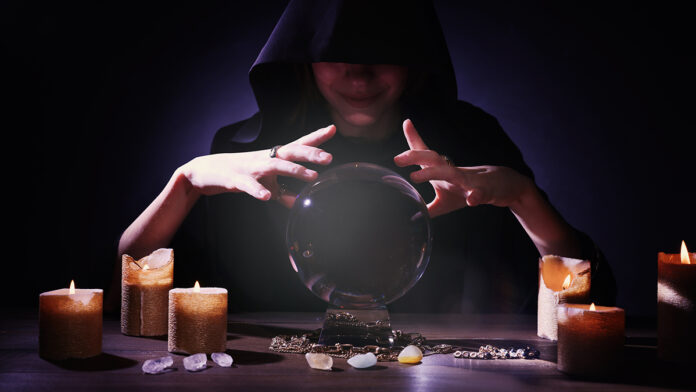 Soothsayer,Using,Crystal,Ball,To,Predict,Future,At,Table,In