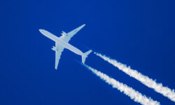 SharpTelephotoClose-upOfJetPlaneAircraftWithContrailsCruising