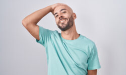 Андрей Зберовский и Дарья Миронова раскрывают энергетические секреты успешных мужчин MiddleAgeBaldManStandingOverWhiteBackgroundSmilingConfident