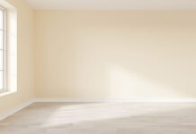 EmptyBeigeWallInteriorWithWoodenFloorBigWindowAnd