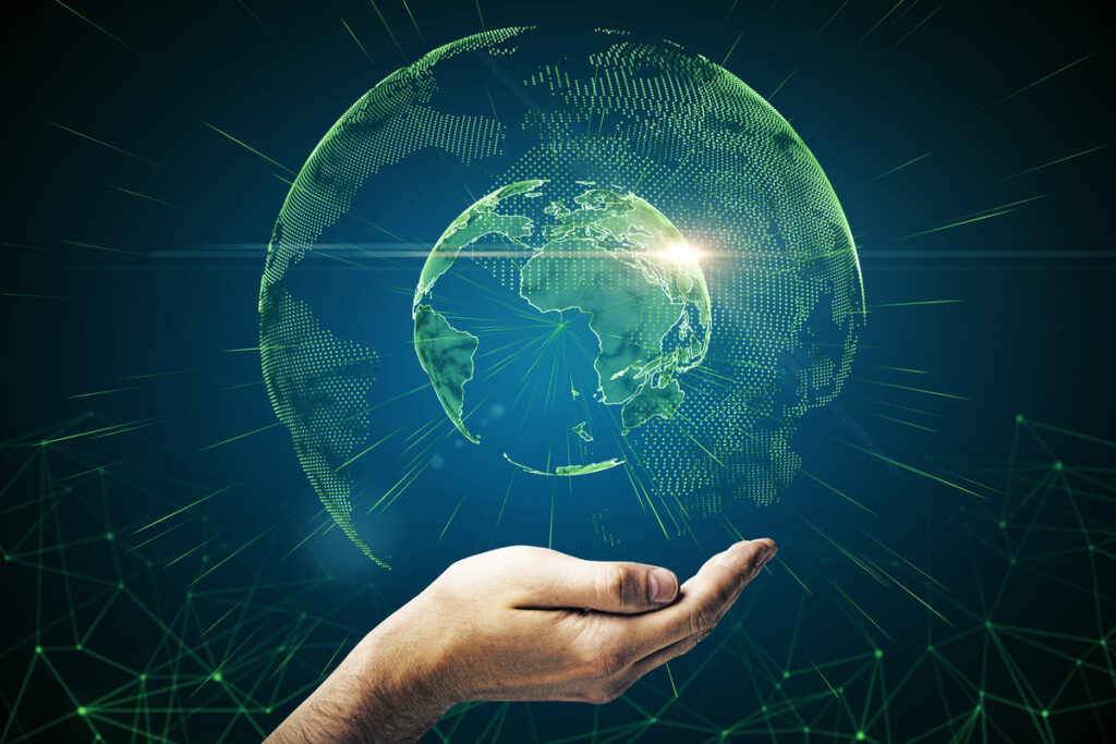 Цифровое изображение планеты Земля и рука
