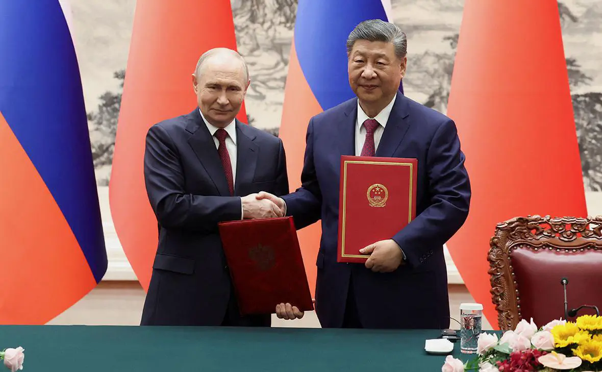 Владимир Путин и Си Цзиньпин (Максим Шеметов / Reuters)