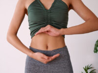 Cropped,Shot,Of,A,Young,Multi-ethnic,Woman’s,Stomach,Cupped,By