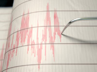 A,Closeup,Of,A,Seismograph,Machine,Needle,Drawing,A,Red