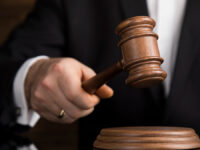 Justice,And,Law,Concept,,Male,Judge,In,A,Courtroom,Striking