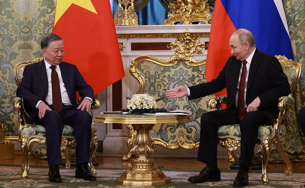 То Лам и Владимир Путин (Антон Ваганов / Reuters)