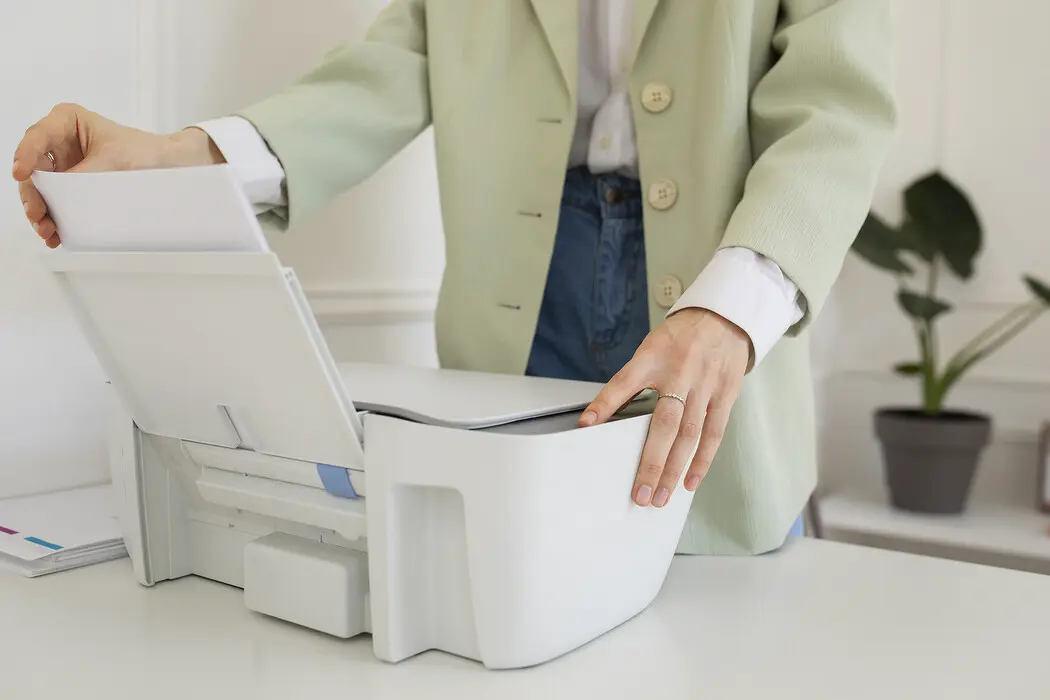 side-view-woman-using-office-printer_1.jpg