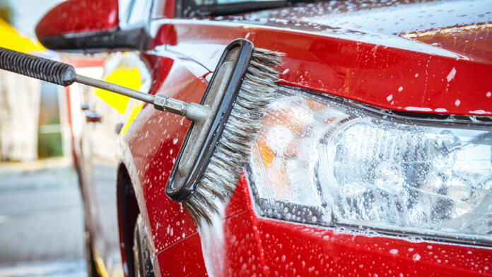 ContactlessCarWashSelf-serviceYoungManWashingHisCar