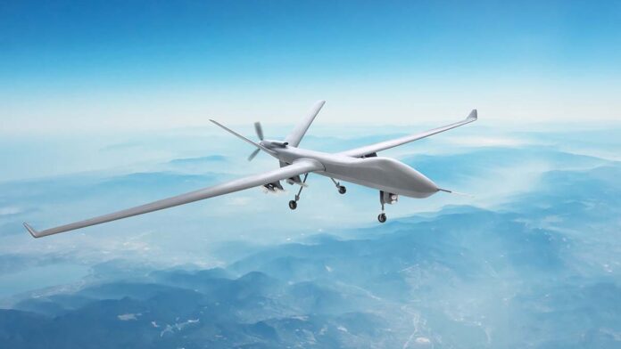 UnmannedSpyMilitaryDroneFliesOverMountainsAtDayTime