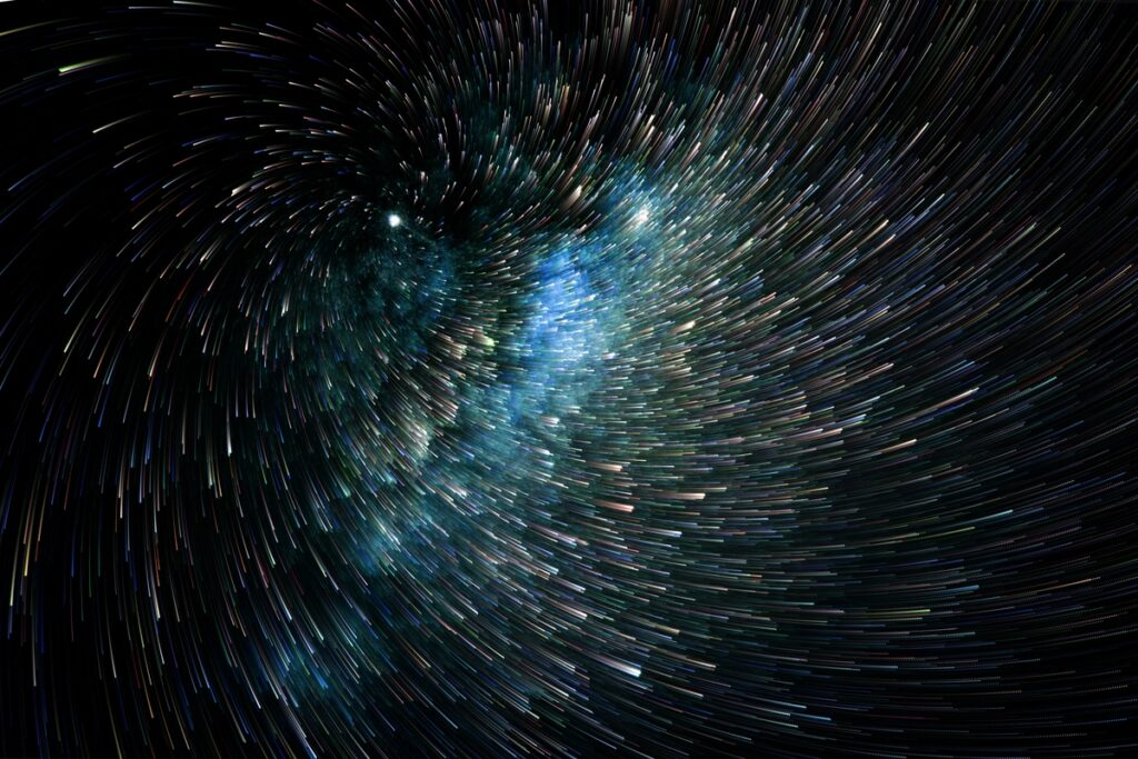 длительная экспозиция вихревых светлых искр на темном фоне