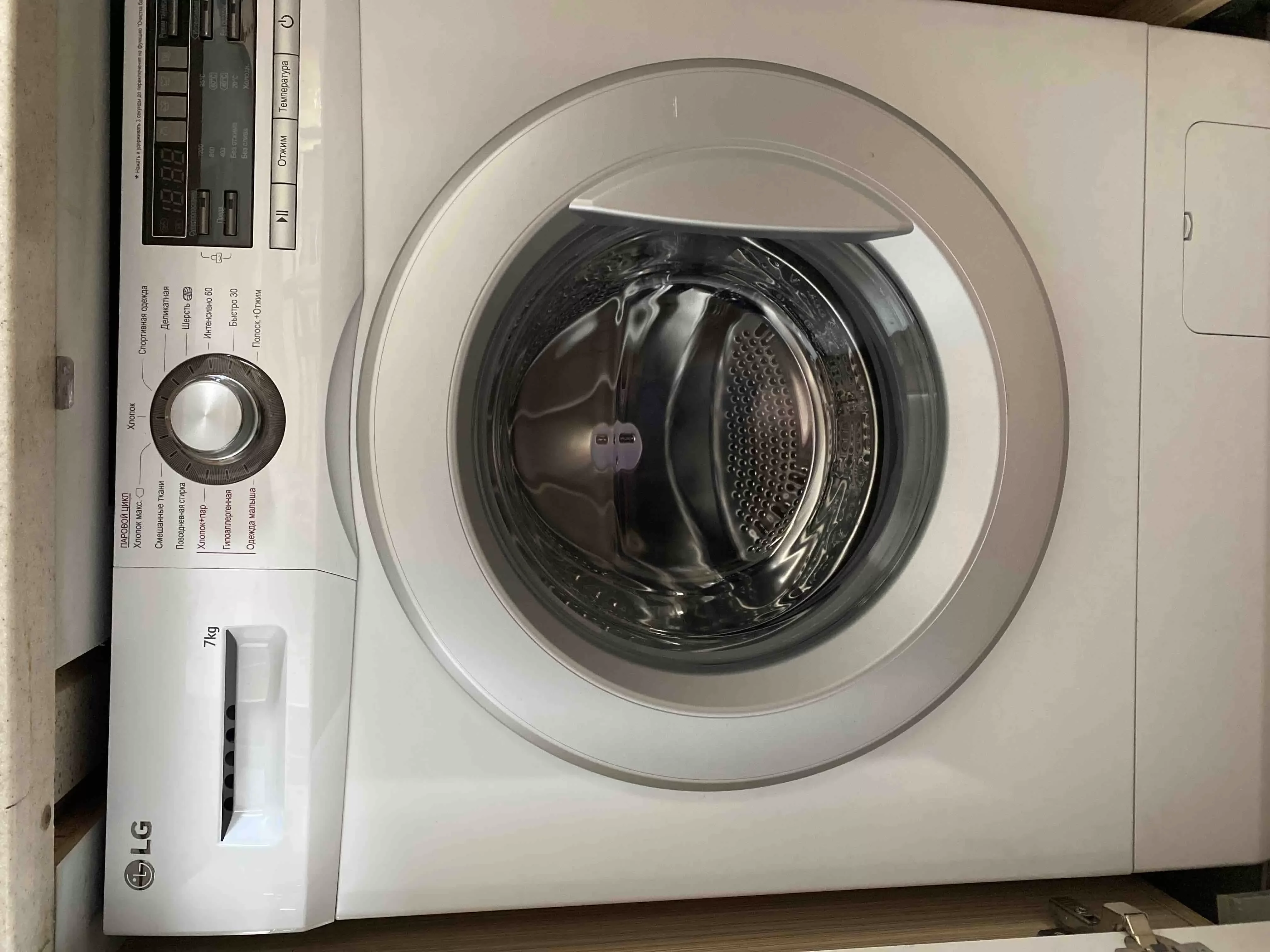 Стиральная машина LG F1296HDS1 7 кг 1200об/мин 60х44х85 см Инвертор Пар  белый/серебро