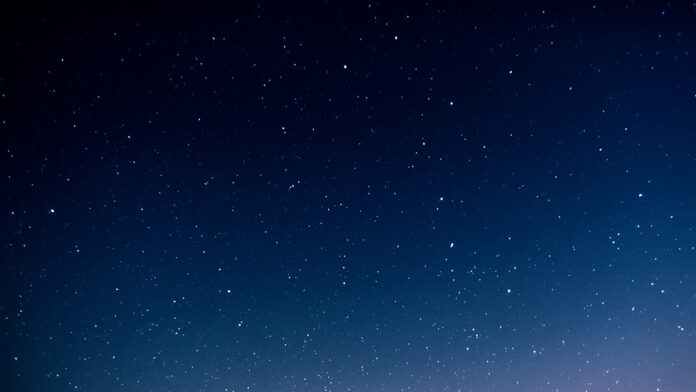 NightSkyFullOfStarsAndSunriseOnTheBackground