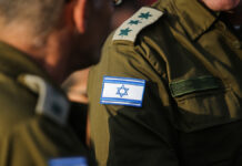 DetailsWithTheIsraeliFlagOnAMilitaryMedicUniform
