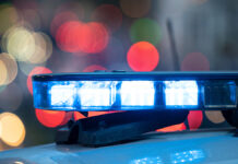 BlueLightsOnTheRoofOfAPoliceCarWith