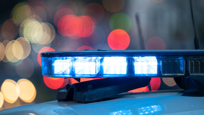 BlueLightsOnTheRoofOfAPoliceCarWith