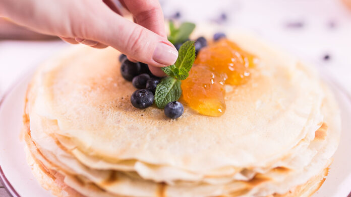 ThinPancakesWithJamMintAndBlueberriesTastyCrepesOn