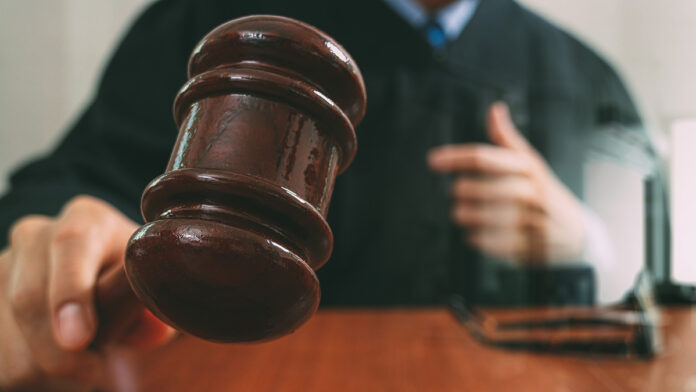 JusticeAndLawConceptmaleJudgeInACourtroomWithThe