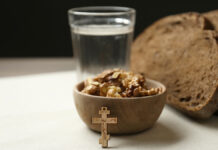 BreadWalnutsWaterAndCrucifixOnTableGreatLentSeason