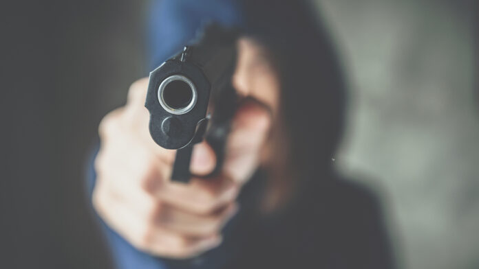 CroppedShotOfFemaleCriminalorThiefWearingHoodAnd