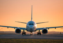 TrafficAtAirportAtGoldenSunsetFrontViewOfTaxiing