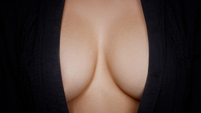 ToplessBeautyWomanBodyCoveringHerBreast
