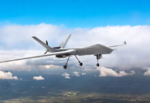 PatrollingUnmannedAircraftInTheSkyAboveTheTerrainFly