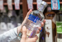 LosAngelesCausa4102019CustomerHandHoldingABottleOf