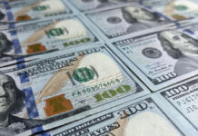 BanknotesOf100DollarBackgroundOfCashDollarBillsAmerican