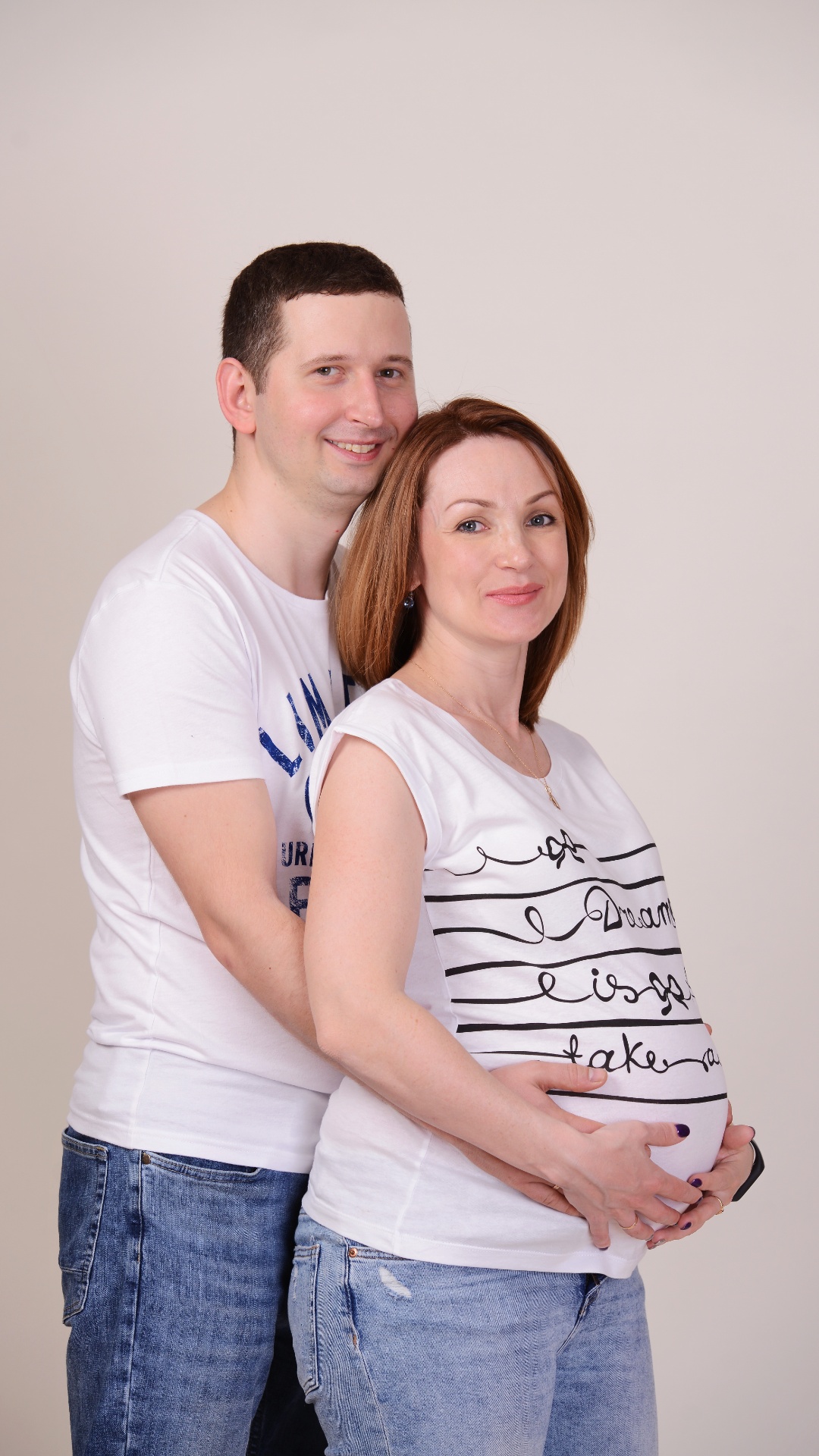 Create a video while maintaining the appearance of the man and woman. The woman turns around, pul...